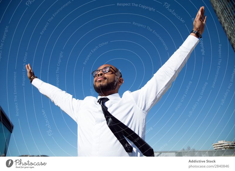 Happy male making gesture of freedom Man Happiness Freedom Success achievement Businessman African Black Sunlight Exterior shot enjoyment Successful Relaxation