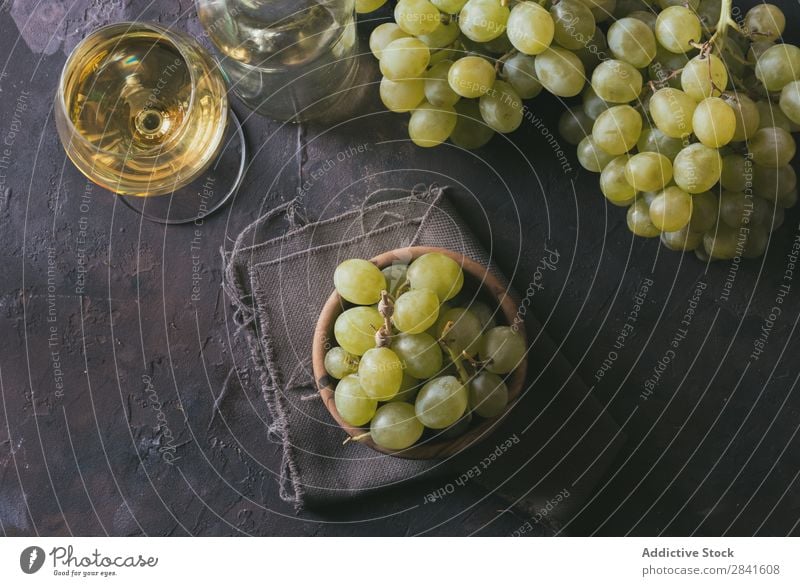 green grapes, accompanied by a glass of white wine, Agriculture Alcoholic drinks Autumn Background picture Blue Bottle bunch Close-up Accumulation Dark Drinking