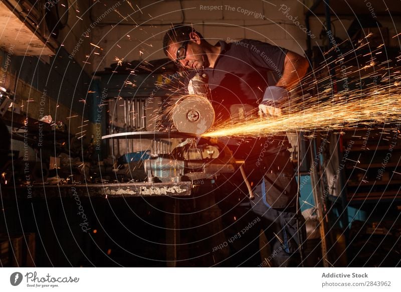 worker using an angle grinder Employees &amp; Colleagues Metal Grinder Corner Spark Technology Power Industry Steel Industrial Tool Electric Factory Blade