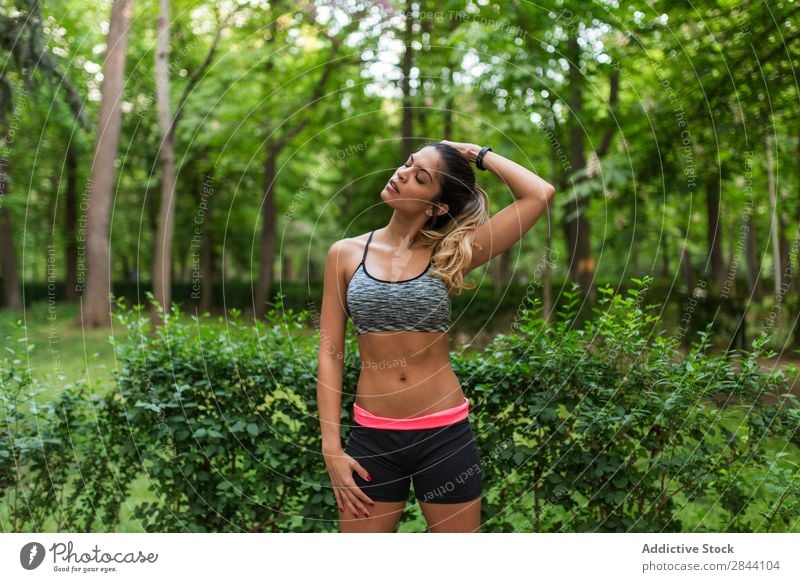 Girl training in summer park Woman workout Green Stretching Park Sportswear Action Flexible Concentrate Warming up Practice Inspiration Street sportswoman Town