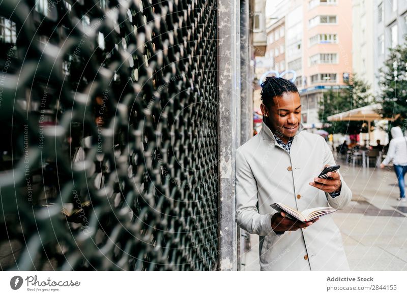 Black businessman talking phone at street Man Notebook Street Planning Lifestyle Technology Date Businessman To talk Easygoing Modern Smart occupation