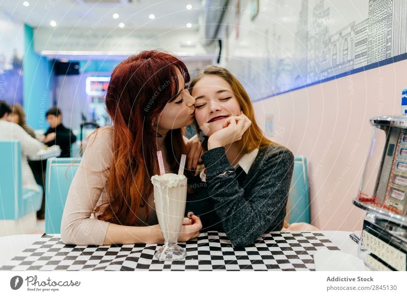 Cheerful women having cocktails Woman pretty Town Friendship Together Sit Drinking Milkshake Smiling Youth (Young adults) Beautiful Café Attractive Lady Fashion