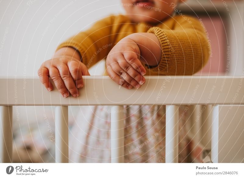 Low Section Of Baby Girl Standing On Crib At Home Child Toddler Lifestyle colorful Yellow Cute Joy Happy Playing Infancy Human being Caucasian Innocent