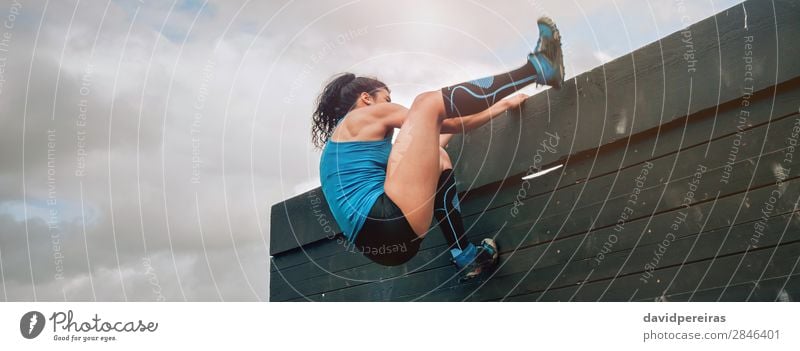 Woman in obstacle course climbing wall Lifestyle Sports Climbing Mountaineering Internet Human being Adults Sneakers Strong Effort Energy Competition