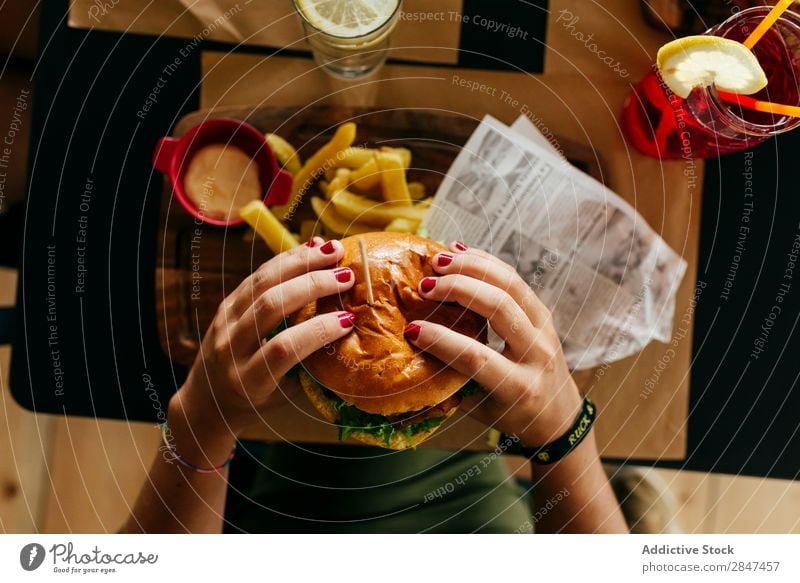 Crop woman picking a hamburger Fries Fast food Hamburger Food Fresh Meat Meal Unhealthy Snack Sandwich Speed Roll Tasty Lettuce Delicious Classic Gourmet Lunch