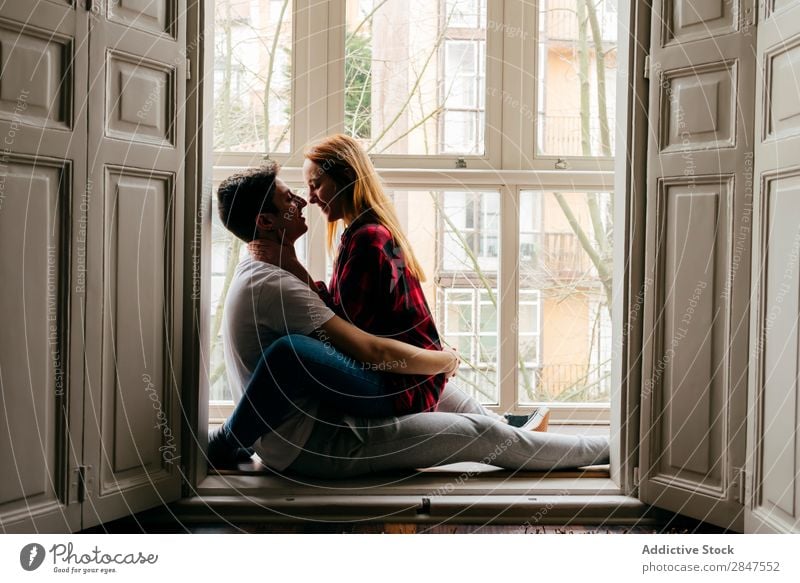 Couple kissing on window sill Love embracing Window tenderness Kissing Bonding Youth (Young adults) Beautiful Man Woman Relationship Romance Together Attractive