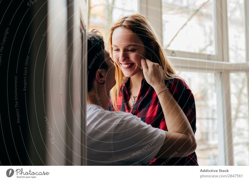 Cheerful couple on window sill Couple Love embracing Window Smiling Bonding tenderness Youth (Young adults) Beautiful Man Woman Relationship Romance Together