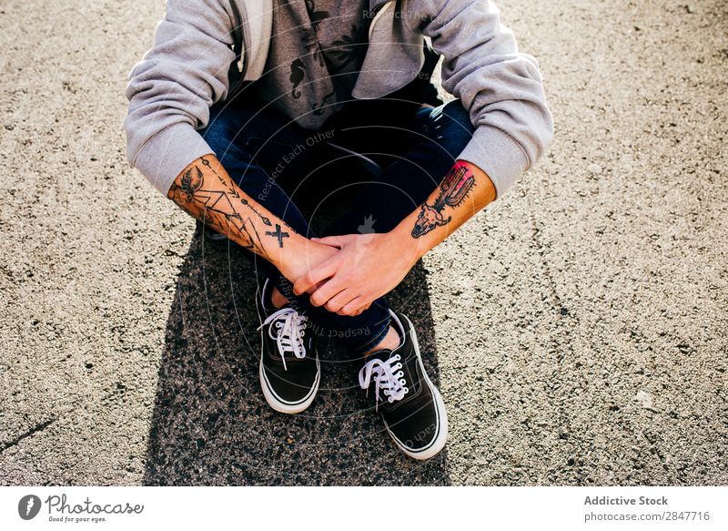 Crop tattooed man from above Man Hipster Tattooed Town Uniqueness millennial Ground Sidewalk Grunge Summer Style Sit Easygoing Hair and hairstyles