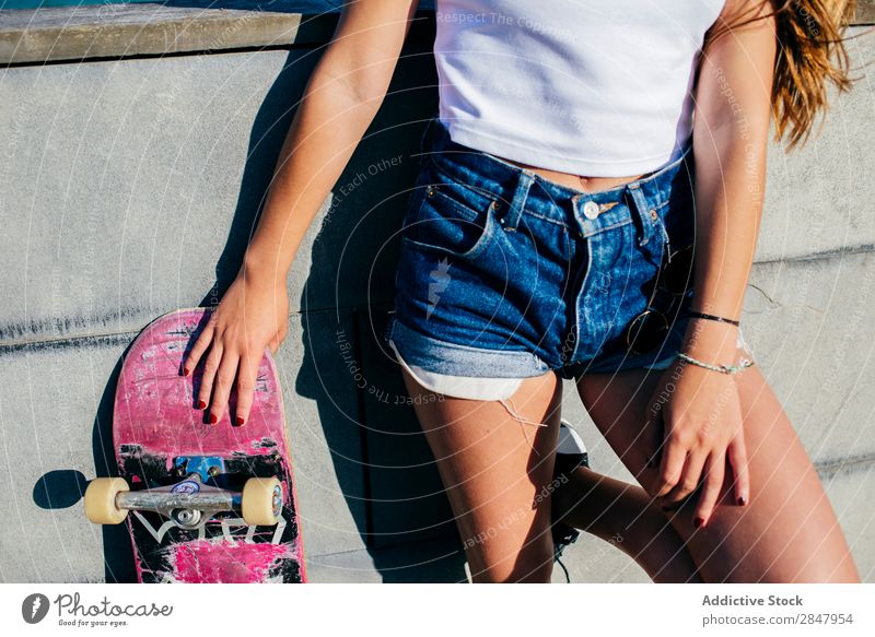 Crop girl posing with old skate Woman Skateboard Youth (Young adults) Town Hipster Skateboarding Posture Street Nature Park Relaxation Self-confident Lean Style