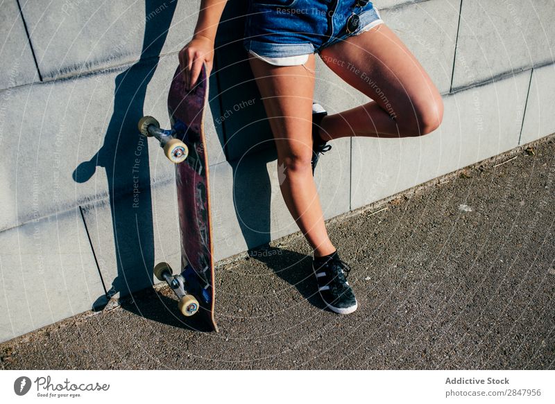 Crop girl posing with old skate Woman Skateboard Youth (Young adults) Town Hipster Skateboarding Posture Street Nature Park Relaxation Self-confident Lean Style