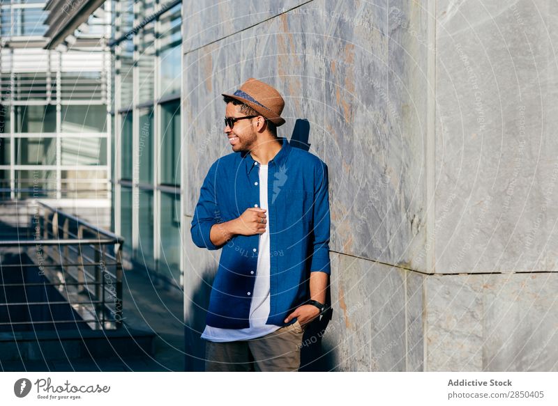 Man with hat posing in wall City Stand Hat Human being Town Adults Modern Lifestyle Loneliness Portrait photograph fashionable Fashion Elegant Wall (building)