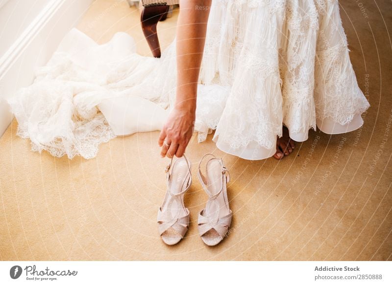 Crop bride putting on shoes Bride Footwear Dressing Wedding Preparation bridal Lace High heels Wear romantic fancy Smock Feasts & Celebrations White Clothing