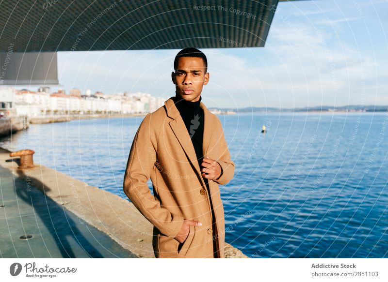 Black man in stylish coat at embankment Man Youth (Young adults) fashionable City Coat Embankment seaside Ocean Water Town Adults Fashion Street Lifestyle