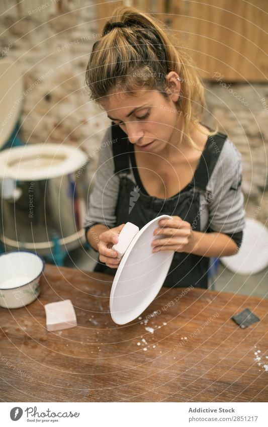 Woman working with clay plates Workshop Crockery handwork ceramics Professional Make craftsmanship Enamel Clay Handicraft clay ware Work and employment creating