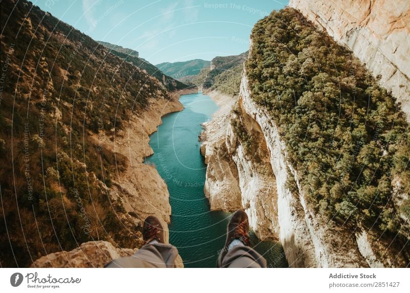 Legs of man sitting at the edge on Mont-Rebei Canyon, Lleida, Spain River Landscape Human being Crops Unrecognizable body part Nature Vacation & Travel Rock