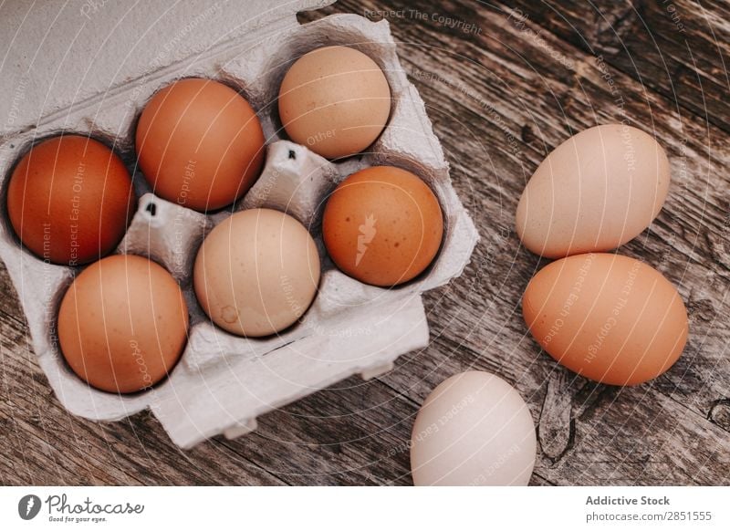 Eggs on a wooden table Wood Table Background picture Box lay Countries Village Flat Food Top Farm White Fresh Ingredients Easter Breakfast Chicken Healthy Brown