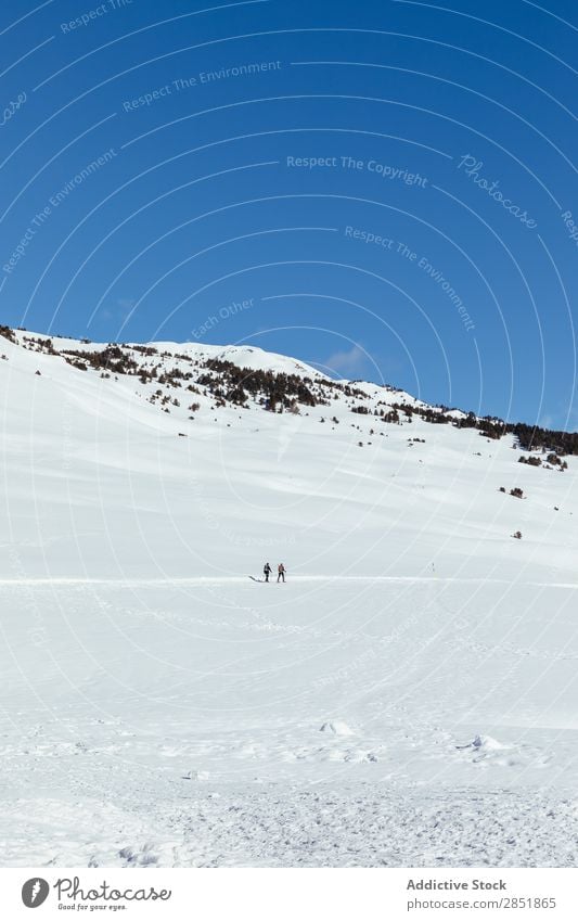 People walking through the snow Snow Mountain Winter Human being Snow shoes Nature Ski resort White hiker Landscape Adventure Man Woman Sports Hiking Sky Cold