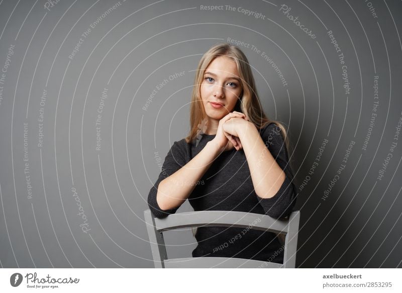 young woman sitting astride chair Human being Feminine Young woman Youth (Young adults) Woman Adults 1 13 - 18 years 18 - 30 years Blonde Long-haired Sit