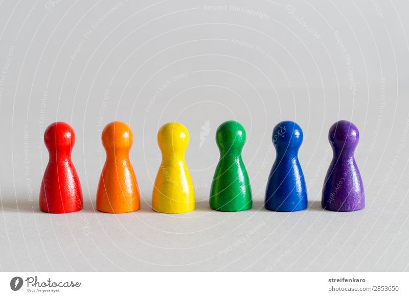 Playing figures in rainbow colours stand in a row Homosexual Group Toys Wood Sign Esthetic Happiness naturally Blue Multicoloured Yellow Green Violet Orange Red