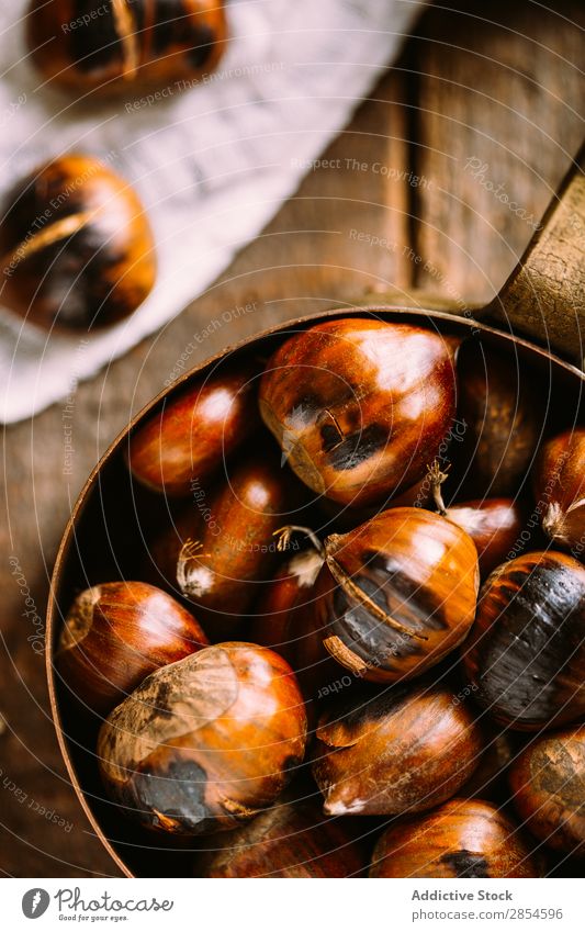 Roasted chestnuts Autumn Brown Chestnut Cooking Copper Food Fruit Grunge Hot Nut October Pan Raw Rustic Pot Holiday season Wood