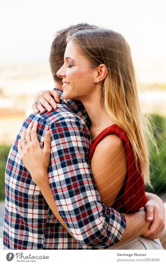 Young loving couple hugging in the street. Couple Love Woman Relationship Youth (Young adults) Beautiful Embrace Romance Happiness Kissing romantic Smiling