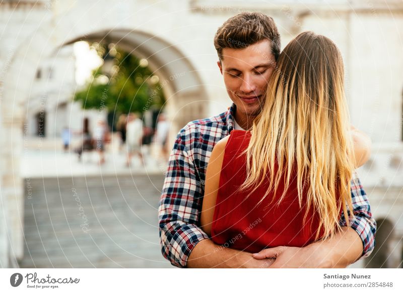 Young loving couple hugging in the street. Young Love Concept. Couple Woman Relationship Youth (Young adults) Beautiful Embrace Romance Happiness Kissing