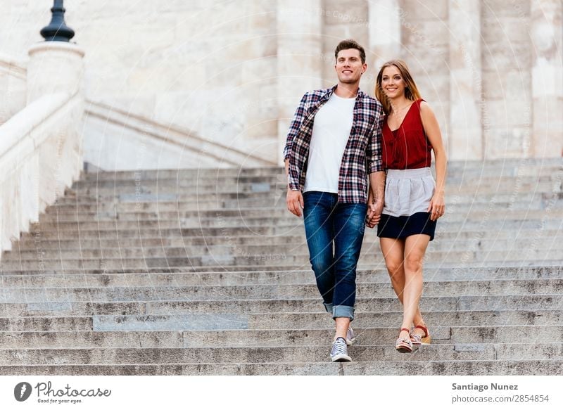 Romantic Young Couple Walking in the City. Relationship Love Youth (Young adults) Happy Laughter Smiling Human being Stairs Going Downward Summer Street Europe