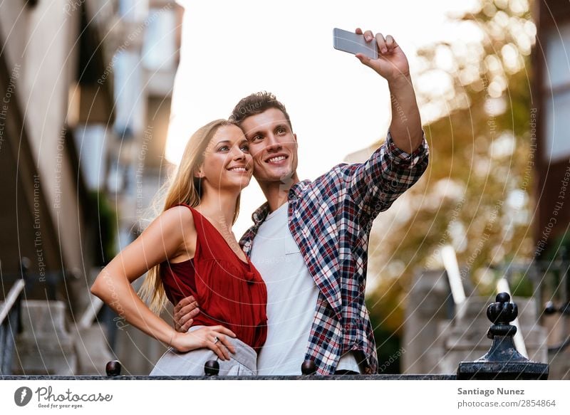 Romantic Young Couple taking a photo with mobile phone. Selfie Take Youth (Young adults) Telephone Photography Mobile Solar cell Self portrait Human being