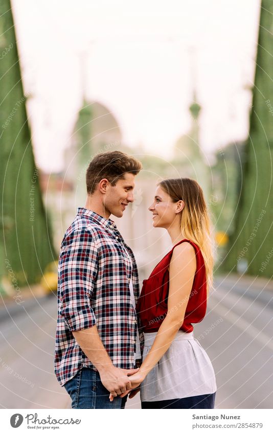 Young loving couple hugging in the street. Couple Love Woman Relationship Youth (Young adults) Beautiful Embrace Romance Happiness Kissing romantic Smiling