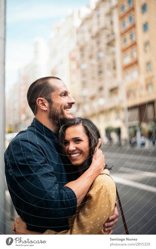 Smiling couple of lovers having fun. Woman Date Love Embrace Man Girl Youth (Young adults) Romance Couple City Happiness Happy Human being Together Street