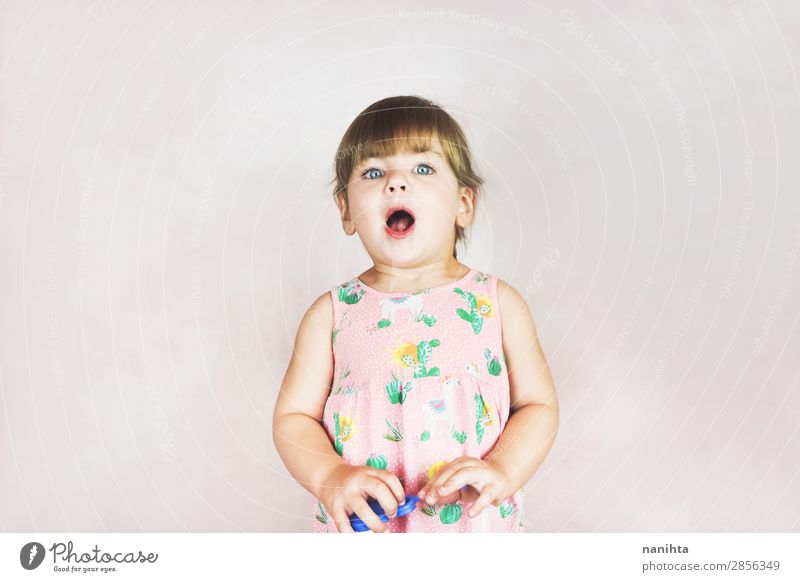 Young little and funny girl in a studio shot Lifestyle Style Joy Face Child Human being Feminine Toddler Girl Infancy 1 1 - 3 years Dress Blonde To enjoy