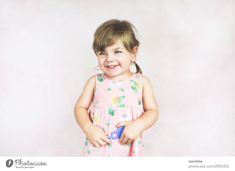 Young little and funny girl in a studio shot Lifestyle Joy Face Wellness Child Human being Feminine Toddler Girl Infancy 1 1 - 3 years Dress Blonde To enjoy
