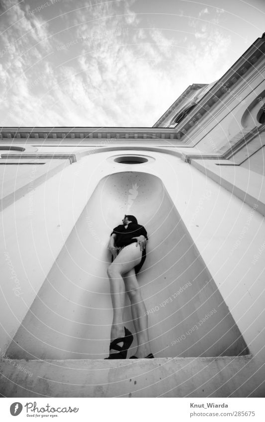 the sky is the limit Human being Feminine Woman Adults Legs 1 Wall (barrier) Wall (building) Facade Stand Eroticism Long Black & white photo Exterior shot