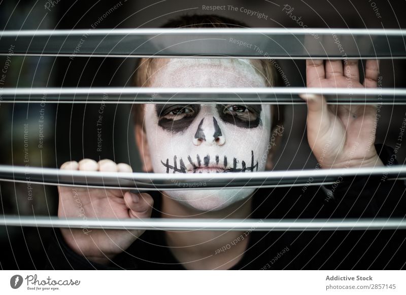 Boy with face painted like a skull Delightful Black boo Boy (child) Caucasian Child Costume Creepy Dark Dramatic Fear Funny Hallowe'en Hidden Lifestyle Make-up