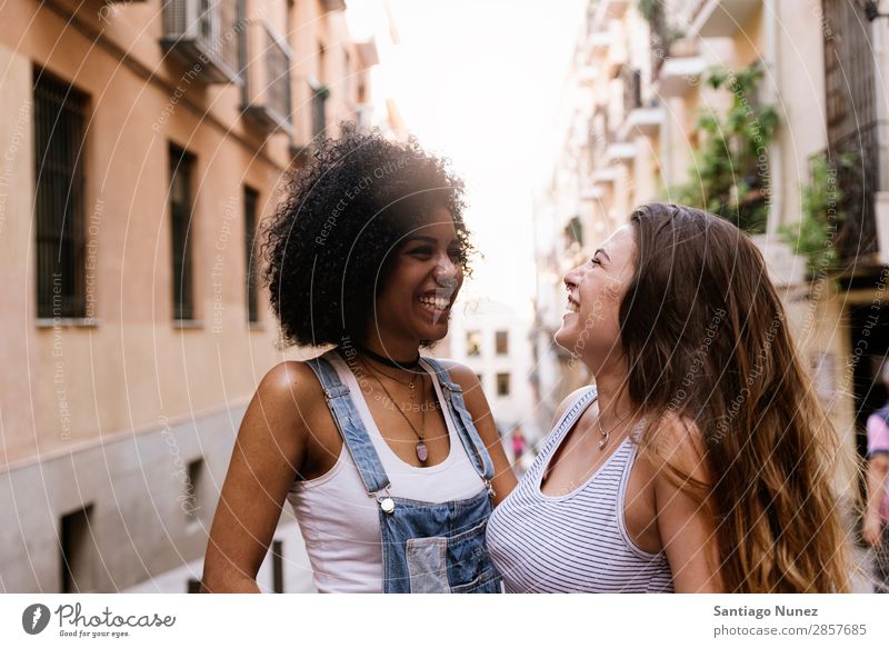 Beautiful women having fun in the street. Woman Friendship Afro Youth (Young adults) Happy Summer Portrait photograph Human being Joy Smiling Walking Racism