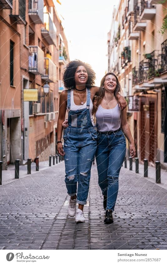 Beautiful women having fun in the street. Woman Friendship Afro Youth (Young adults) Happy Summer Human being Joy Smiling Walking Girl pretty 2 Together Couple