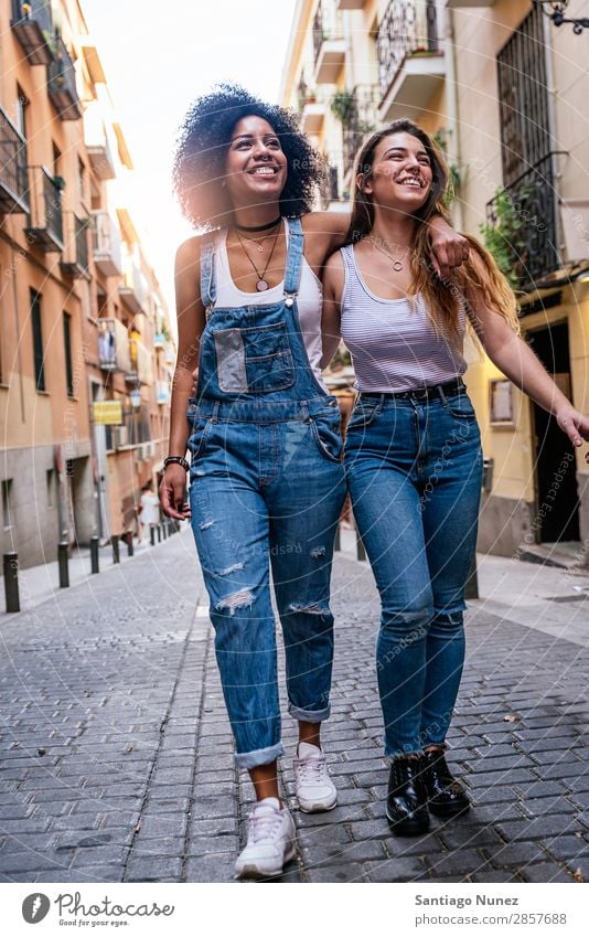 Beautiful women having fun in the street. Woman Friendship Youth (Young adults) Happy Summer Human being Joy Smiling Walking Girl pretty 2 Together Couple