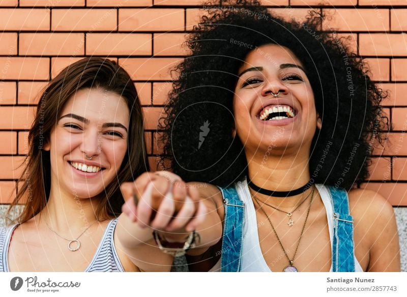 Beautiful women having fun in the street. Woman Friendship Youth (Young adults) Happy Summer Portrait photograph Relationship Human being Joy Smiling Hand