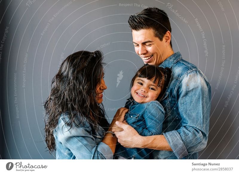 Happy young family with their daughter. Family & Relations Home Youth (Young adults) Child White Human being lifestyle mother Father Embrace Woman Parents
