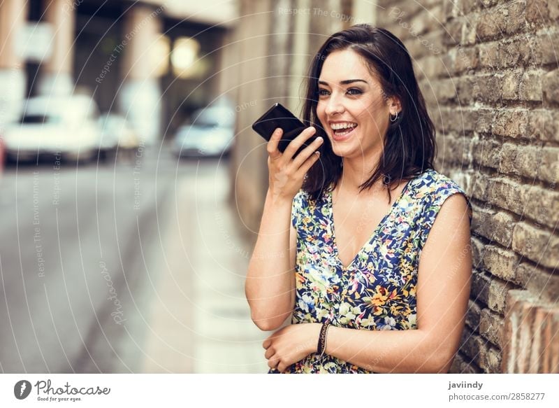 Smiling young woman recording voice note in her smart phone Lifestyle Style Happy Beautiful Hair and hairstyles Telephone PDA Technology Human being Feminine