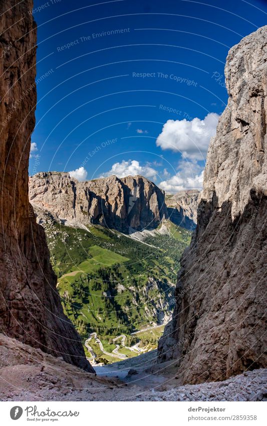 View between two rock crevices to the next mountains in the Dolomites Tourism Structures and shapes Copy Space bottom Vacation & Travel Light Copy Space right
