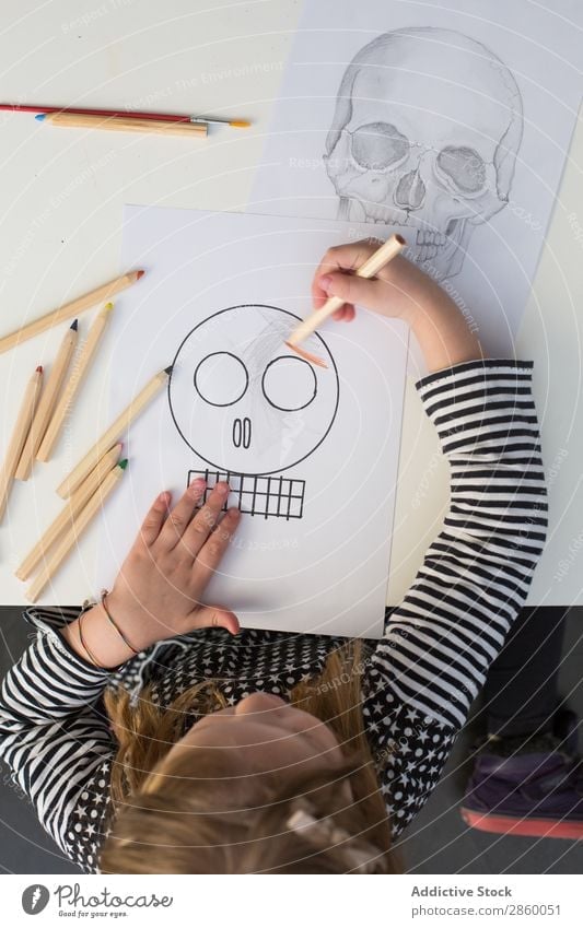 Girl coloring a simple sketch of a skull Art Artist Carbon Colour Multicoloured Creativity Draw Drawing Hand Illustration Child Painting (action, artwork) Paper