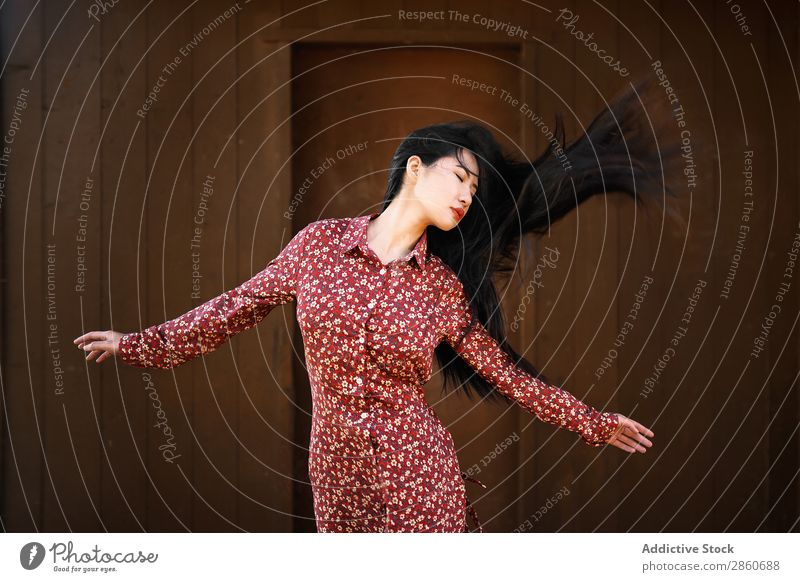 Asian woman shaking hair Woman Youth (Young adults) Attractive Dress Red asian Japanese Hair Joy eyes closed Brunette Beautiful Beauty Photography Human being