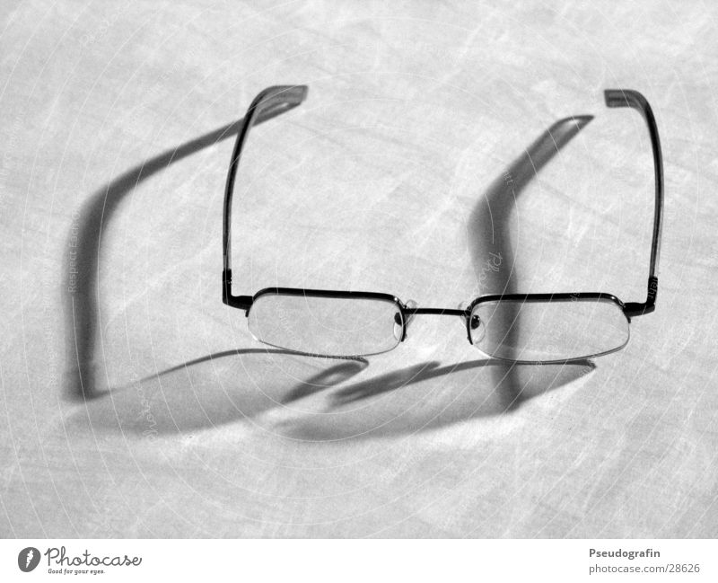 glasses Eyeglasses Glass Plastic Gray Spectacle frame Reflection Black & white photo Interior shot Close-up Neutral Background Evening Artificial light Shadow