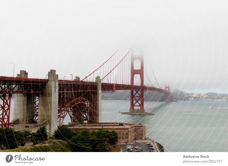 View to bridge in foggy day Bridge Golden Gate Bridge Fog Bay Tower Architecture Landmark Structures and shapes Historic USA California San Francisco Ocean
