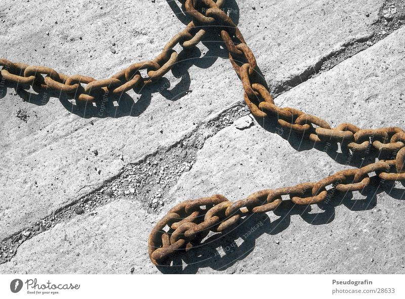 old chain Industry Concrete Rust Brown Diagonal Chain Colour photo Subdued colour Exterior shot Deserted Day Shadow Bird's-eye view