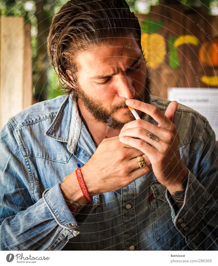 smoky Man Human being Young man Cigarette Ignite Smoking Tobacco products Lighter Beautiful Youth (Young adults) Tattoo Tattooed Facial hair Beard Sit Café