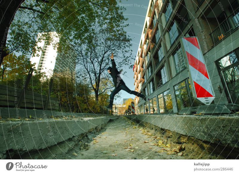 # Just a jump to the left # Human being Masculine Man Adults 1 30 - 45 years Jump Dig Barrier Construction site Signs and labeling High-rise Berlin Conquer