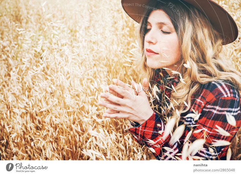 Young cowgirl in a field of cereals Lifestyle Beautiful Hair and hairstyles Wellness Well-being Senses Relaxation Calm Freedom Summer Industry Human being
