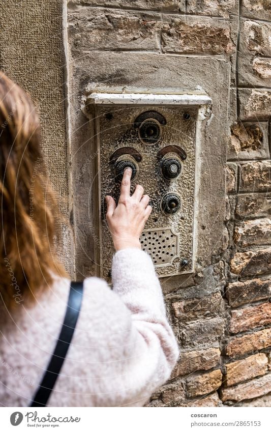 Woman pushing ancient intercom in Venice, taly Lifestyle Design Beautiful Vacation & Travel Tourism Flat (apartment) House (Residential Structure)